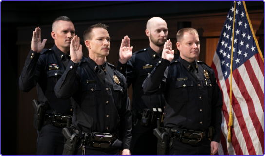 4 police officers being sworn in